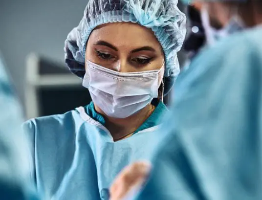 surgeon-in-mask-doing-work Surgeon in Mask