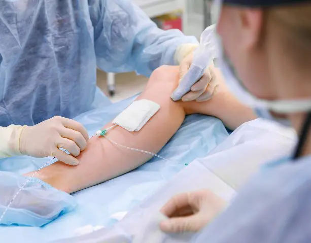 Doctor performing Microphlebectomy Procedure