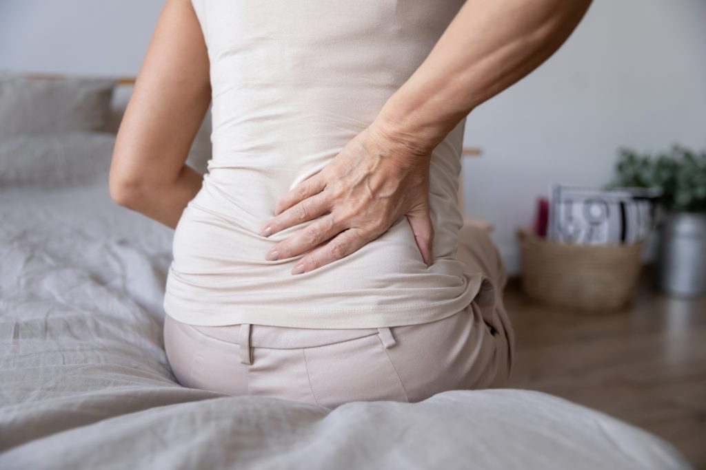 Woman experiencing lower back pain